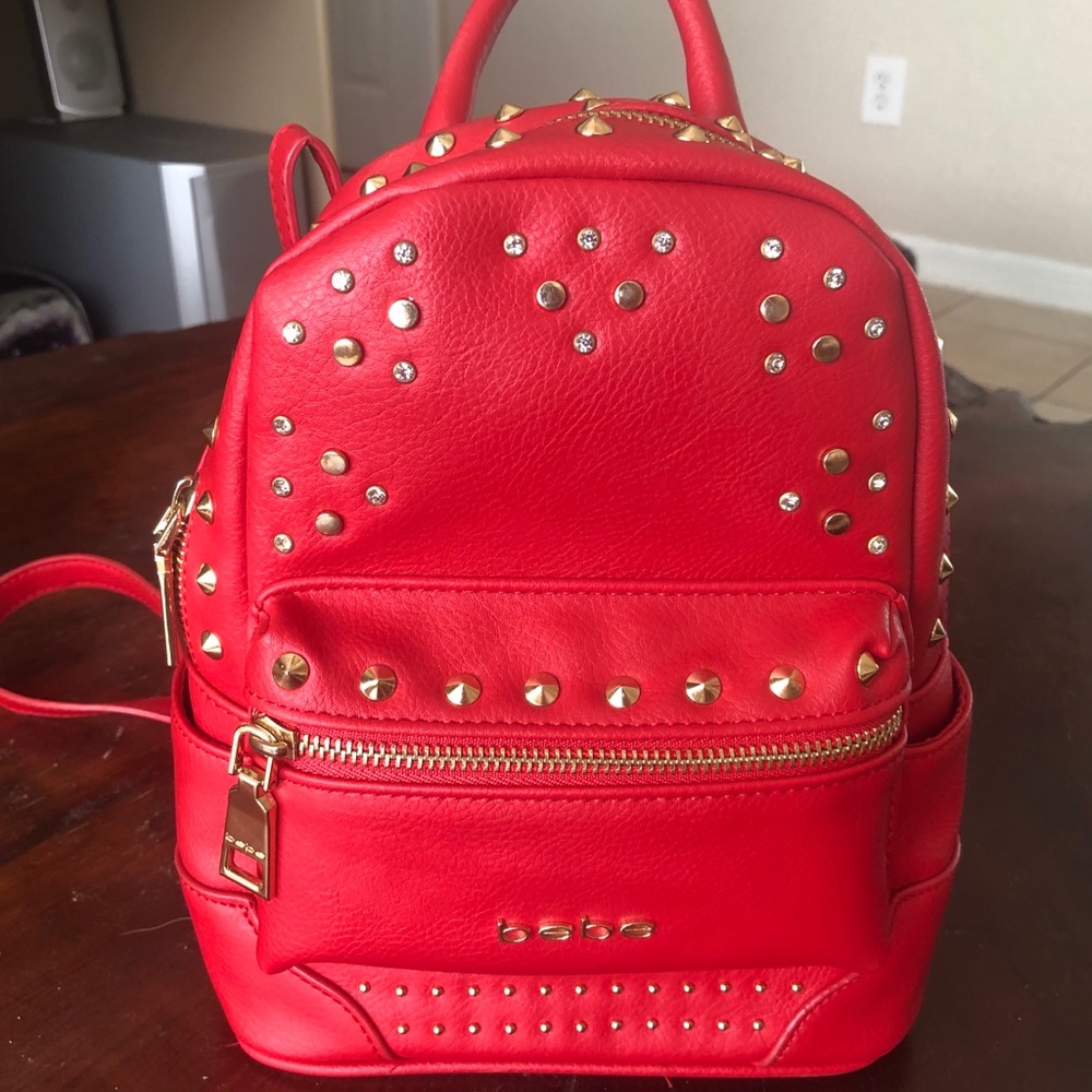 New BEBE red and gold studded Jett mini backpack